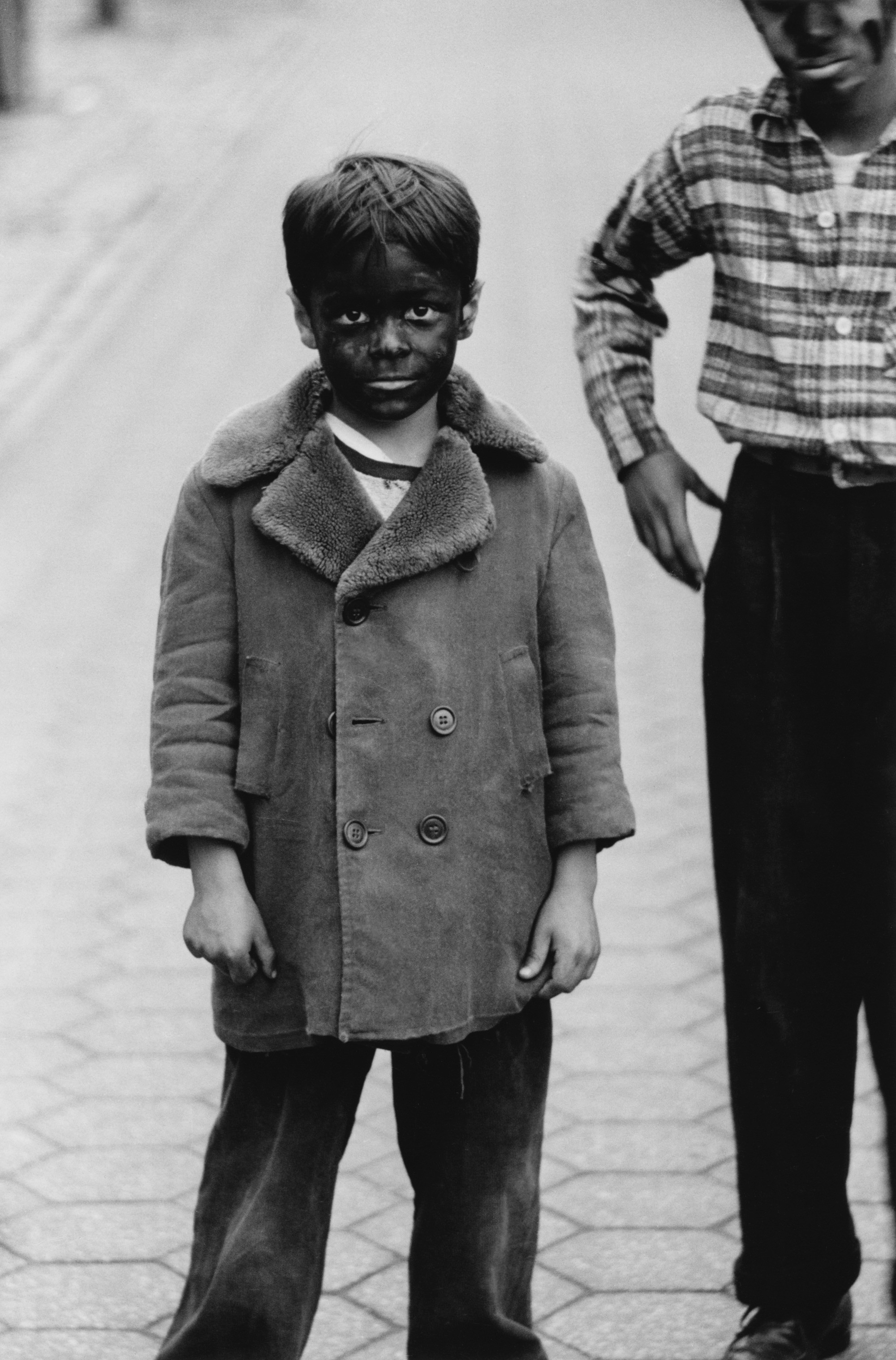 Ребёнок с чёрным лицом, 1957. Фотограф Диана Арбус