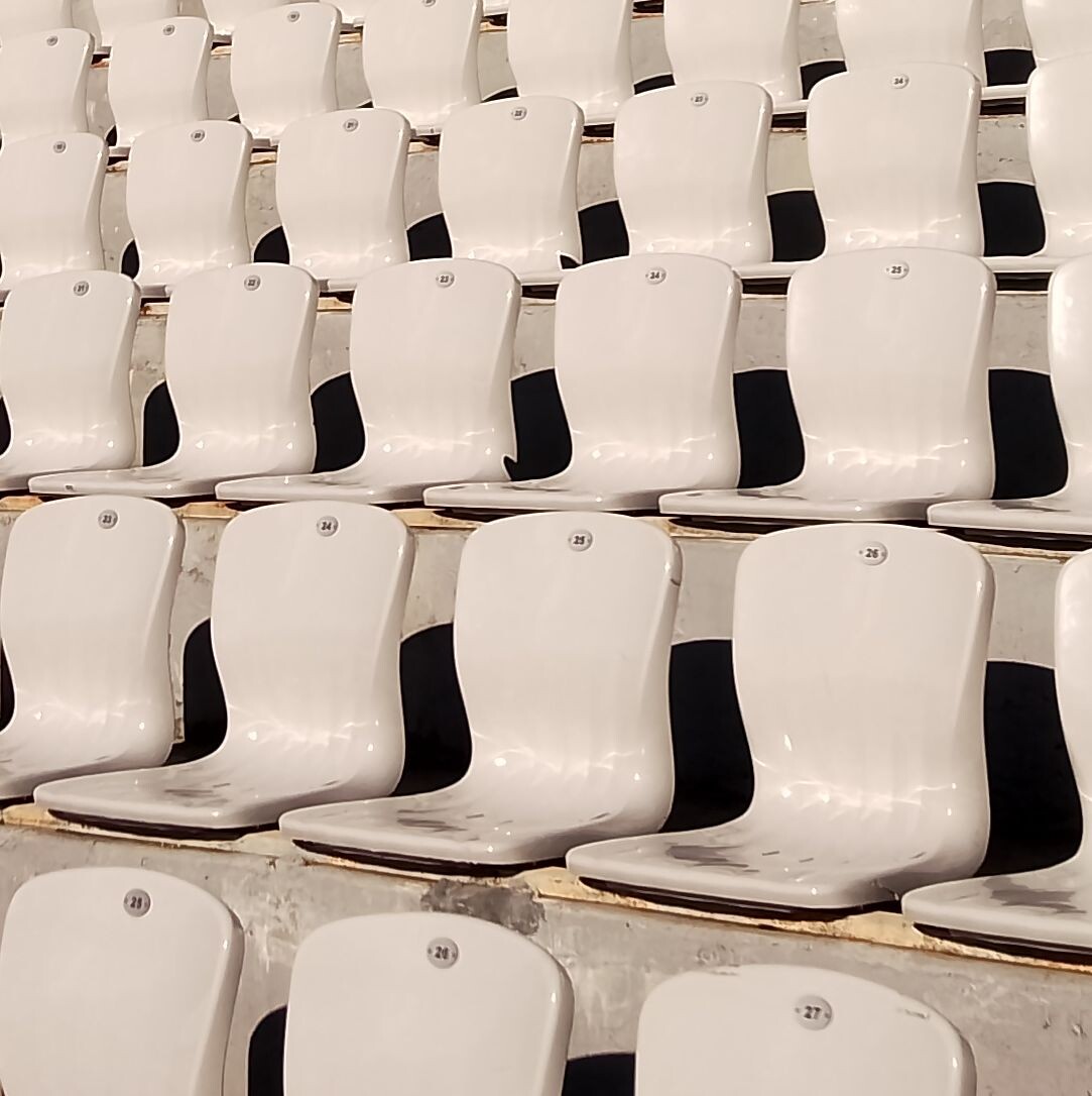 Minimalism in sport. White chairs.