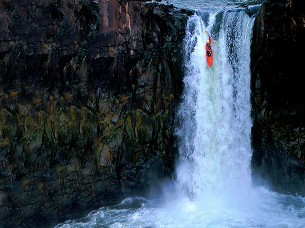 extreme kayaking down waterfall