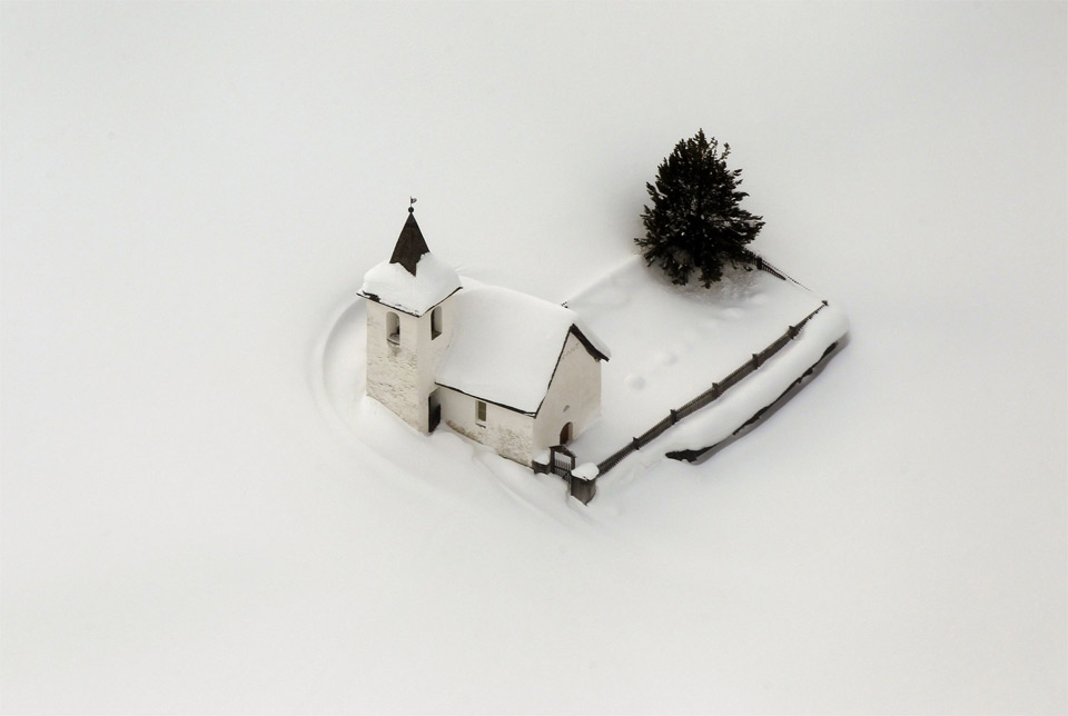 church-in-switzerland-surrounded-by-snow