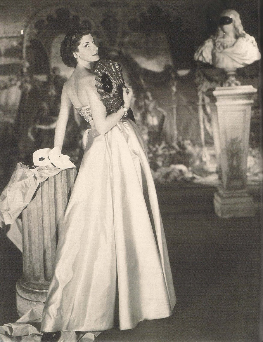 Jane Engelhard with masks and sculpture Vogue 1949